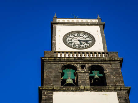 Clock tower of Church of San Sebastian at Ponta Delgada in Ponta Delgada, Sao Miguel Island, Azores, Portugalのeditorial素材