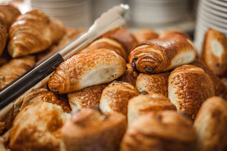 Croissants on a self service breakfast counter in a hotel restaurant