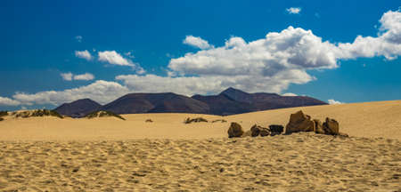 Large rocks and sand dunes, Corralejo Dunes National Park, Fuerteventura, Spain