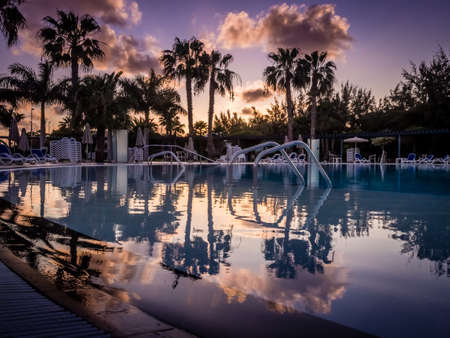 Swimming pool in a resort in Lanzarote at dusk, Canary Islands, Spainの写真素材