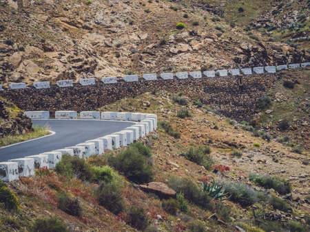 Road going through the landscape of Fuerteventura, Canary Islands, Spainの写真素材
