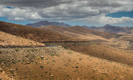 Road going through the landscape of Fuerteventura, Canary Islands, Spainの写真素材
