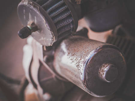A view of the detail of an engine of an old vintage and antique carの写真素材