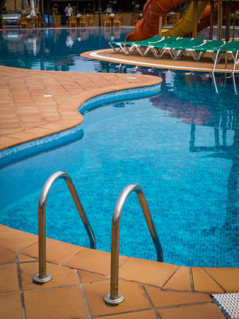 Detail of swimming pool ladder in a holiday resort. Picture taken 11 April 2016のeditorial素材