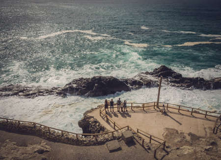 Group of tourists admiring the rocky coast in Ajuy, Parque Rural de Betancuria in Fuerteventura, Canary Island, Spain. Picture taken 13 April 2016のeditorial素材