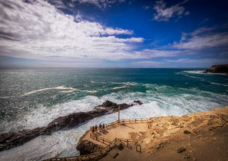 Group of tourists admiring the rocky coast in Ajuy, Parque Rural de Betancuria in Fuerteventura, Canary Island, Spain. Picture taken 13 April 2016のeditorial素材
