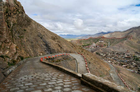Winding road to the monastery in Gyantse town, in the Tibet Autonomous Region of China.の写真素材