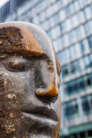 London, England - June 19, 2016: Large blue Purbeck head Bowman statue sculpture by Emily Young in Tate Modernâs extension, Bankside, Londonのeditorial素材
