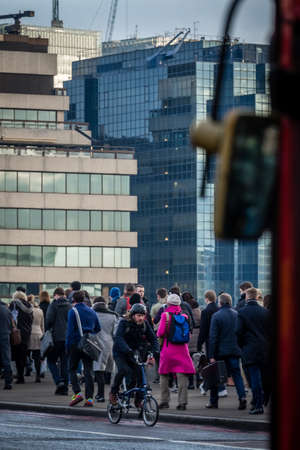 London, England - January 06, 2017: London commuters walking to work over London Bridge in the monday morning rush hourのeditorial素材