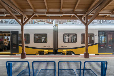 Szklarska Poreba, Poland -  February 2017 :  Ready to depart local train operated by Koleje Dolnoslaskie company standing on a platform on the train station in Szklarska Poreba, Polandのeditorial素材