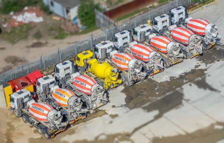 London, England -  25 March 2017 : Parking with Concrete mixing trucks seen from above, London building siteのeditorial素材