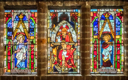 Hever Castle, England -  April 2017 : Stained glass windows in a chapel inside Hever Castle, historical home of Ann Boleyn, the second queen consort of King Henry VIII of Englandのeditorial素材