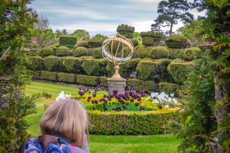 Hever Castle, England -  April 2017 : Tourist looking at the Tudor Chess Set in the Hever castle gardens, Kent, England, UKのeditorial素材