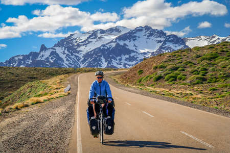 Woman cycling on the famous national Ruta 40 quarenta in central Argentinaの写真素材