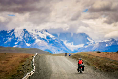 Girl cycling in Torres del Paine National Park, Chile, South Americaのeditorial素材