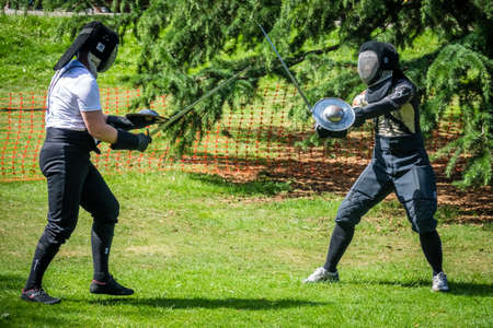 London, England -  June 2017 : Two men fighting with swords during medieval festival in Streathamのeditorial素材
