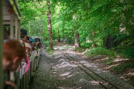 London, England - May 2017 : Narrow gauge tourist train going around the Ruislip Lido lake, London, UKのeditorial素材