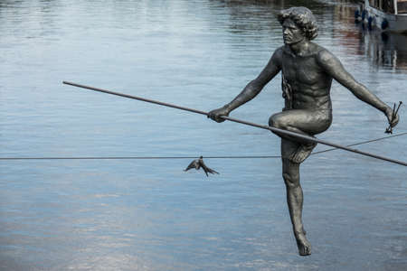 Bydgoszcz, Poland -  August 2017 : The tightrope walker sculpture over the River Brdaのeditorial素材