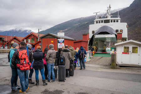 Flam, Norway -  October 2017 :  Group of tourists waiting for the Norway in a nutshell sightseeing cruise through the magnificent Aurlandsfjord and  Naeroyfjord fjordsのeditorial素材