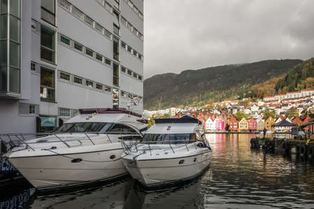 Bergen, Norway -  October 2017 : Two private boats docked in a harbor in the centre of Bergen city, Norwayのeditorial素材