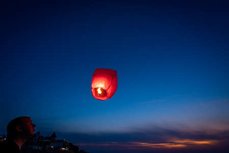 Sarbinowo, Poland -  August 2017 :  People setting off chinese lantern on the beach at sunsetのeditorial素材