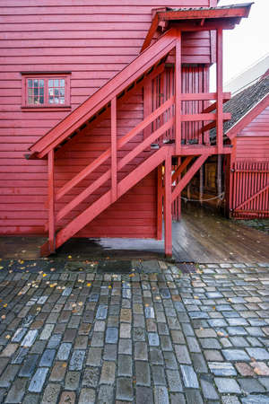 Historic red wooden building in Bryggen, the old town of Bergen, Norwayの写真素材