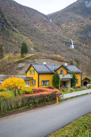 Bergen, Norway -  October 2017 :  Traditional cosy yellow wooden house in a Flam village located in a beautiful mountain valley, Norwayのeditorial素材