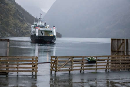 Gudvangen, Norway -  October 2017 :  Passenger ferry leaving Gudvangen after finishing Norway in a nutshell sightseeing tour through the magnificent Aurlandsfjord and the narrow Naeroyfjord, Norwayのeditorial素材