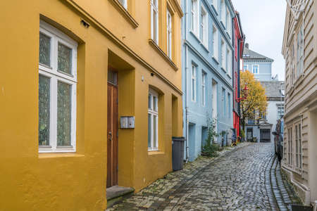 Bergen, Norway -  October 2017 :  Narrow cobble stoned streets between old colorful houses in the old part of Bergen town, Norwayのeditorial素材