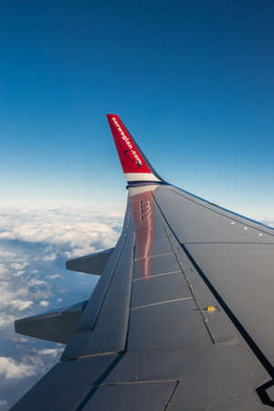Bergen, Norway -  October 2017 :  Norwegian plane winglet flying above the clouds, Norwayのeditorial素材