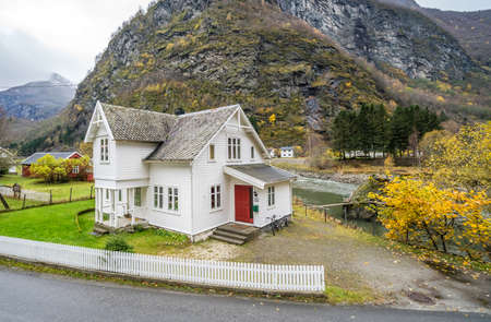 Bergen, Norway -  October 2017 :  Traditional cosy white wooden house in a Flam village located in a beautiful mountain valley, Norwayのeditorial素材