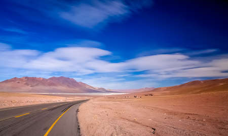 Road leading to the big salar near the famous Valle the la Luna near San Pedro de Atacama in Chileの写真素材
