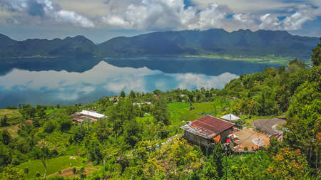 Indonesian home above volcanic Lake Maninjao in Sumatra Island, Indonesia, Asiaの写真素材
