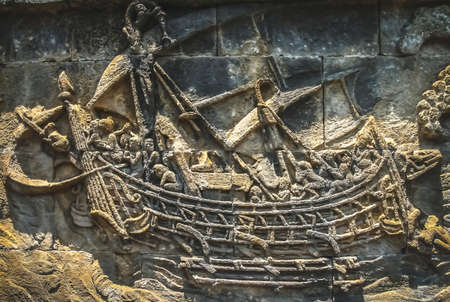 Sailing ship sculpted and carved on the wall in the Borobudur temple in Java, Indonesiaの写真素材