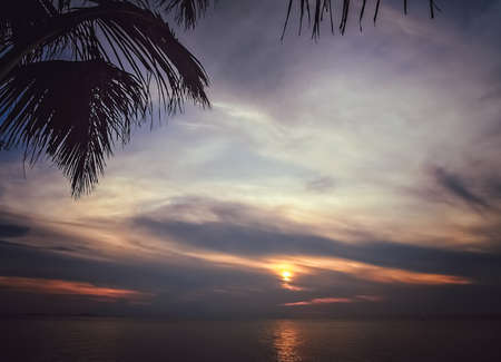 Sunset over the ocean as seen from the beach in Bali, Indonesia, Asiaの写真素材