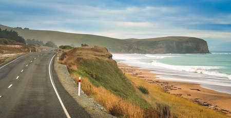 Empty road along New Zealand coast on the southern islandの写真素材