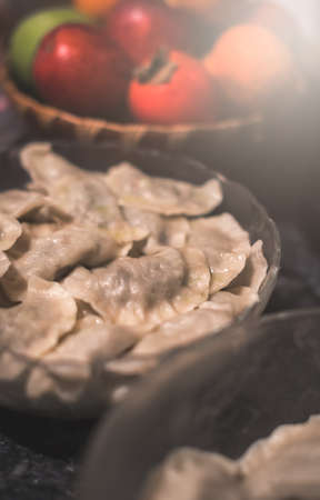 Traditonal Polish food called pierogi in a glass bowl ready to be servedの写真素材