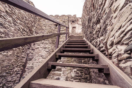 Wooden stairs in the courtyard of the ruins of the medieval Bolkow Castle in Lower Silesia, Polandの写真素材