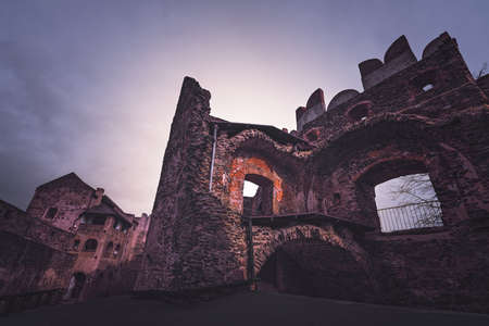Ruins of the medieval Bolkow Castle after sunset, Lower Silesia, Polandの写真素材