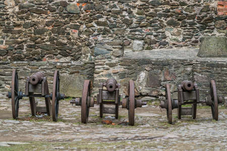 Three old brass cannons in the courtyard of the ruins of the medieval Bolkow Castle in Lower Silesia, Polandの写真素材