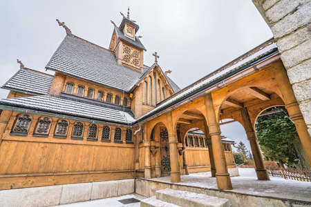 The exterior of the medieval Wang Temple in Karpacz, Poland, photographed in winter. It is a Norwegian stave church which was transferred to Karkonosze mountains.の写真素材