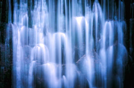 Wild Waterfall, known as Dziki Wodospad, in beautiful scenery of Karkonosze Mountains in Karpacz, Poland, photographed in winterの写真素材