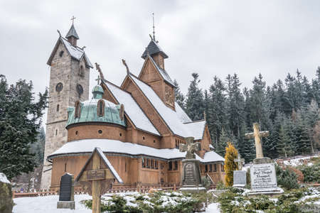Karpacz, Poland -  February 2018 : The medieval Wang Temple photographed in winter. It is a...