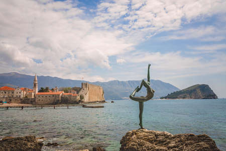 The statue of Ballerina Dancer, standing on the rock, Budva landmark, Montenegroの写真素材