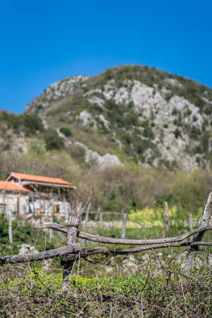 Detail of a fence around the small village homes in a mountain valley in Montenegro in summerの写真素材