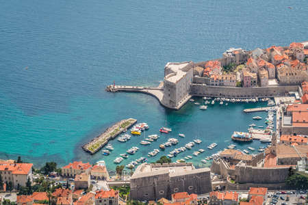 Aerial view of the Dubrovnik old town marina and Old Town walls, Croatiaの写真素材