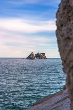 Small secluded monastery on the tiny rocky island in Petrovac bay in Montenegro, the Adriatic seaの写真素材
