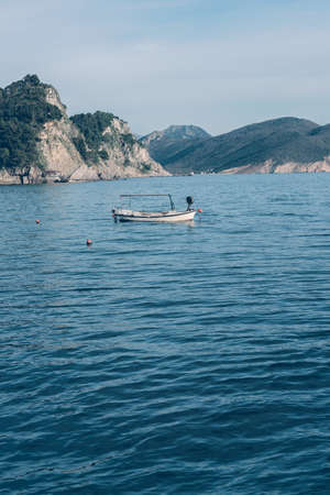 Small private boat in Petrovac bay in spring, Montenegroの写真素材