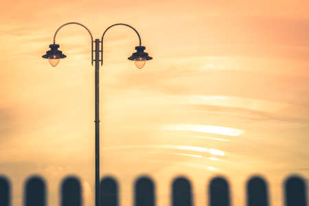 Picture of a street lamp during orange sunset, Penzance, Cornwall, Ukの写真素材