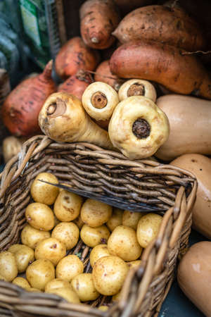 Red and white potatoes in a wicker basket for sale on a farmers market in Cornwall, england, Uk